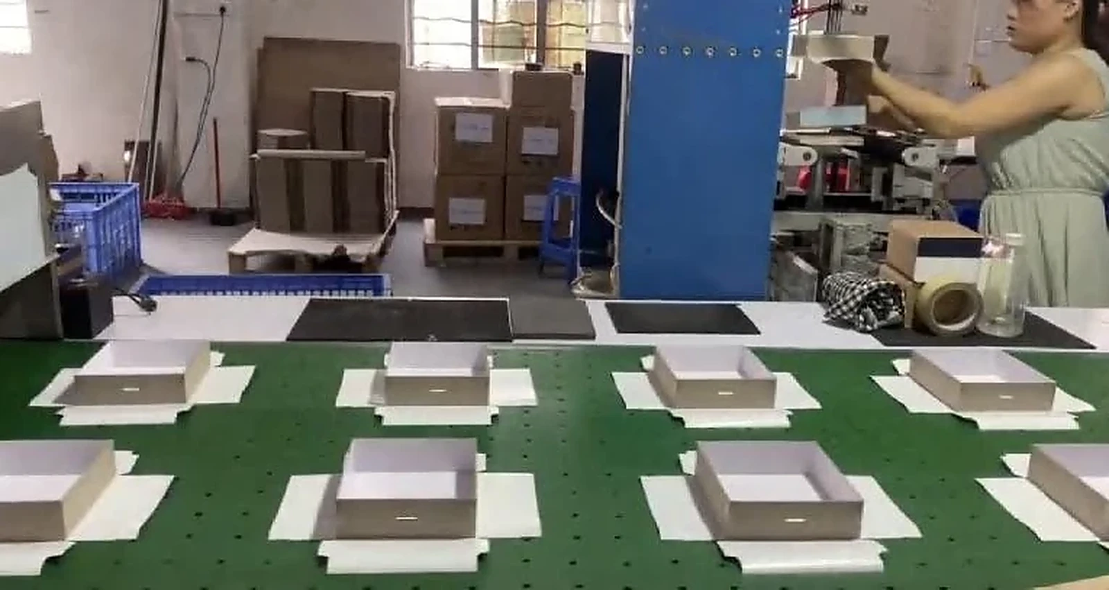 Company-supplied production-floor photo showing visible paper-product handling work