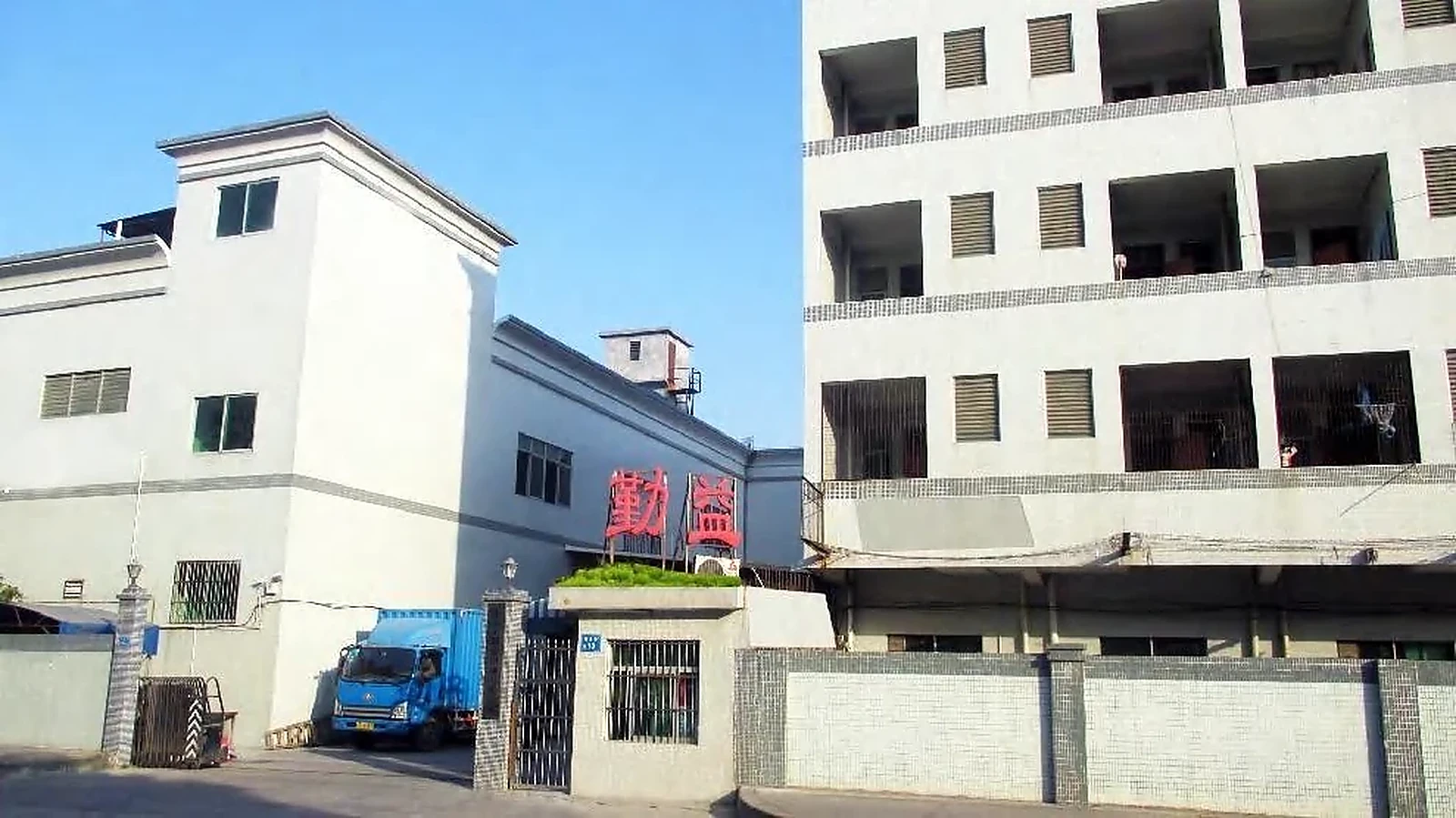 Company-provided image showing a factory exterior in Dongguan, Guangdong
