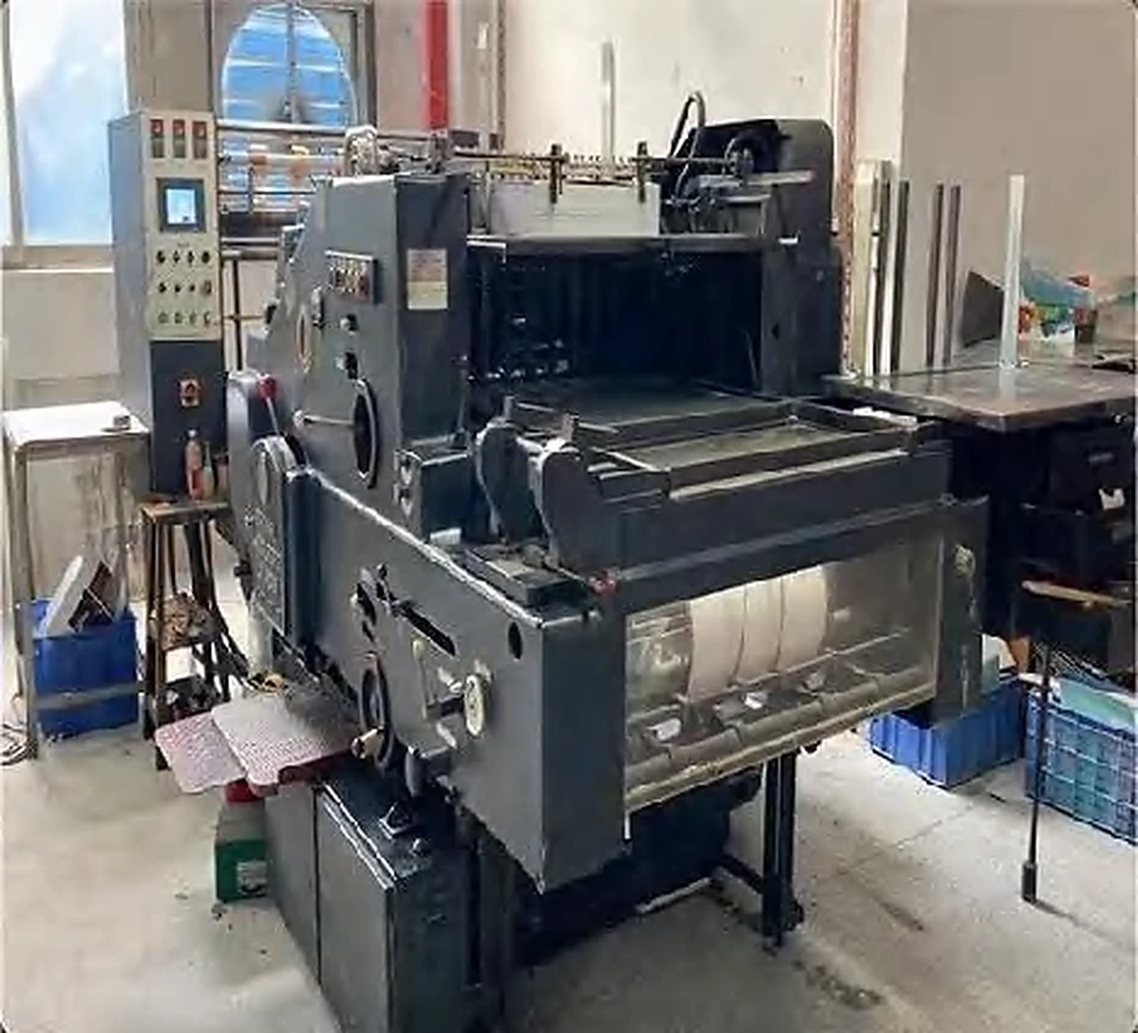 Company-supplied production-floor photo showing visible paper-product handling work