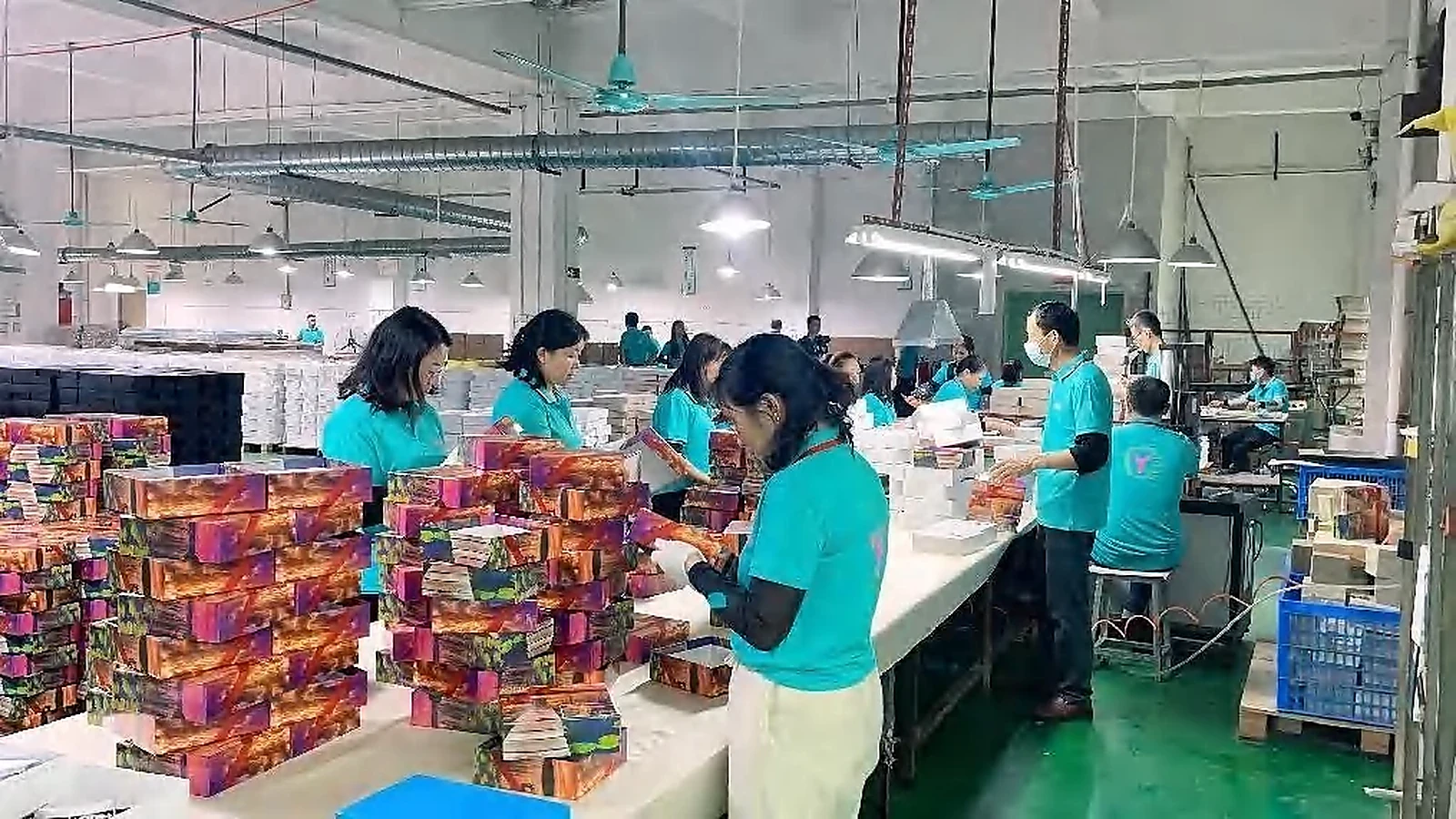 Company-provided image showing assembly and packing of printed products