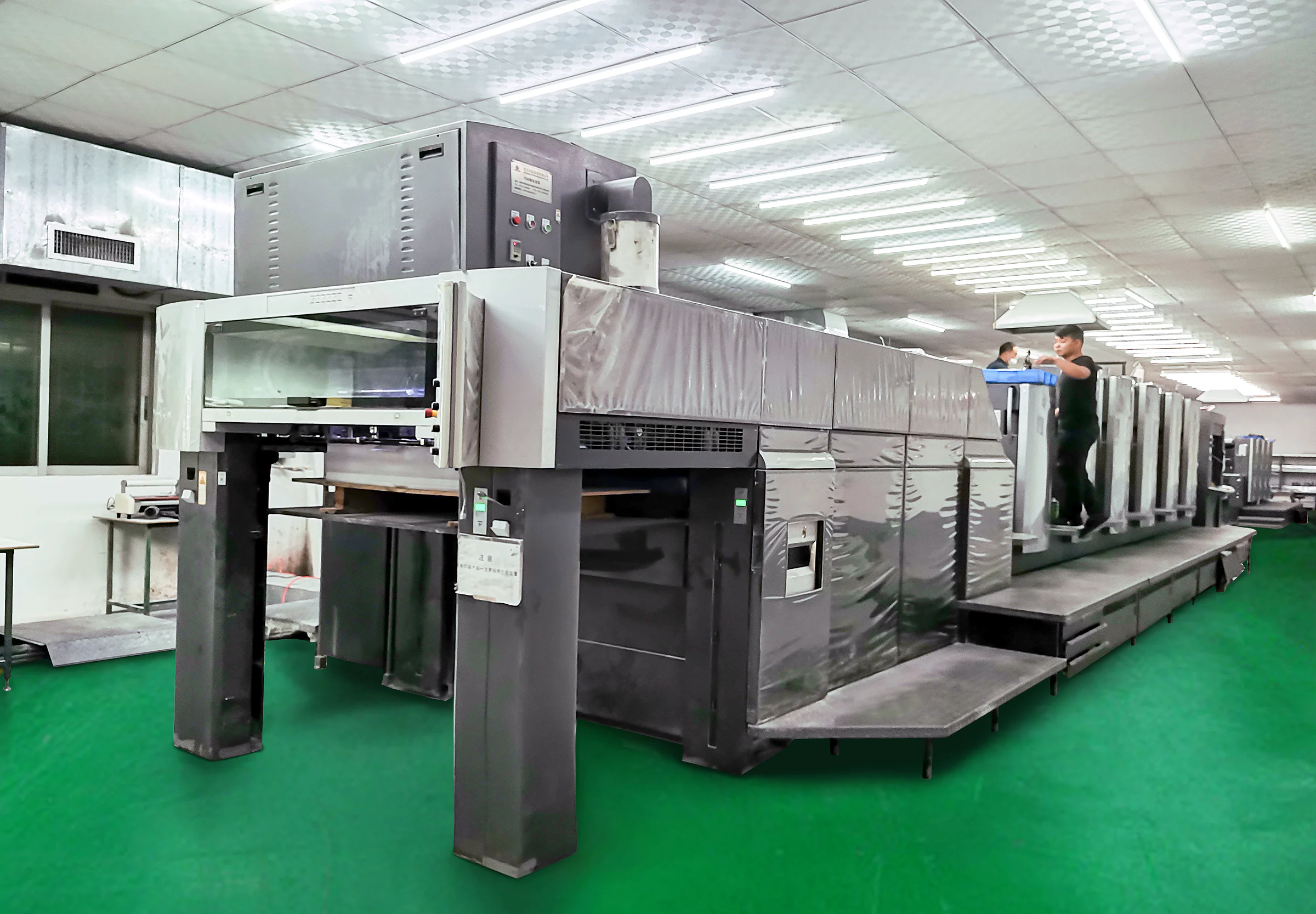 Company-supplied printing-equipment photo; equipment and facility attribution pending