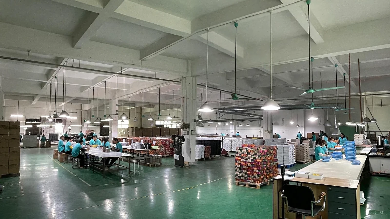Company-provided image showing a Dongguan production workshop with paper products in process