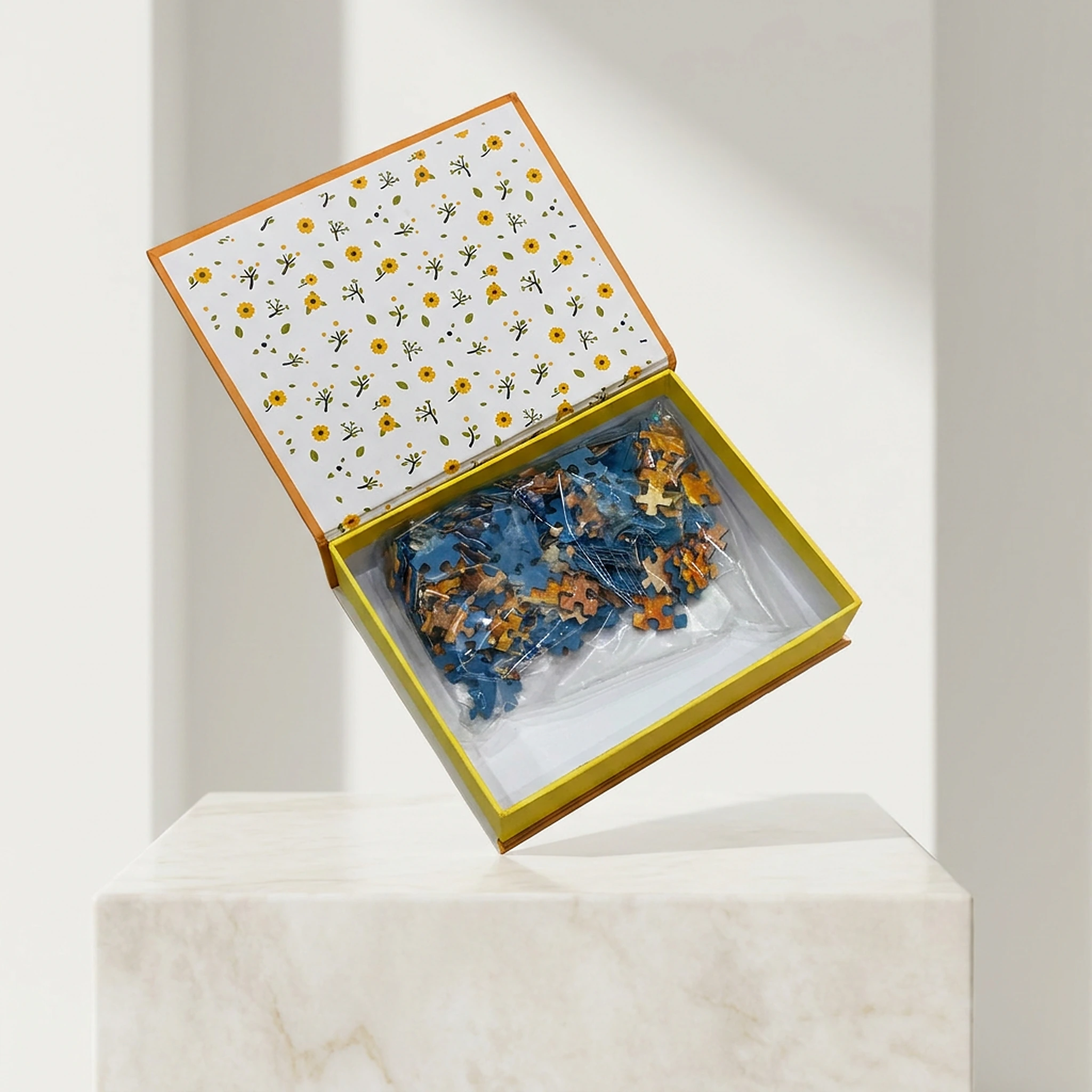 Open puzzle gift box with bagged pieces
